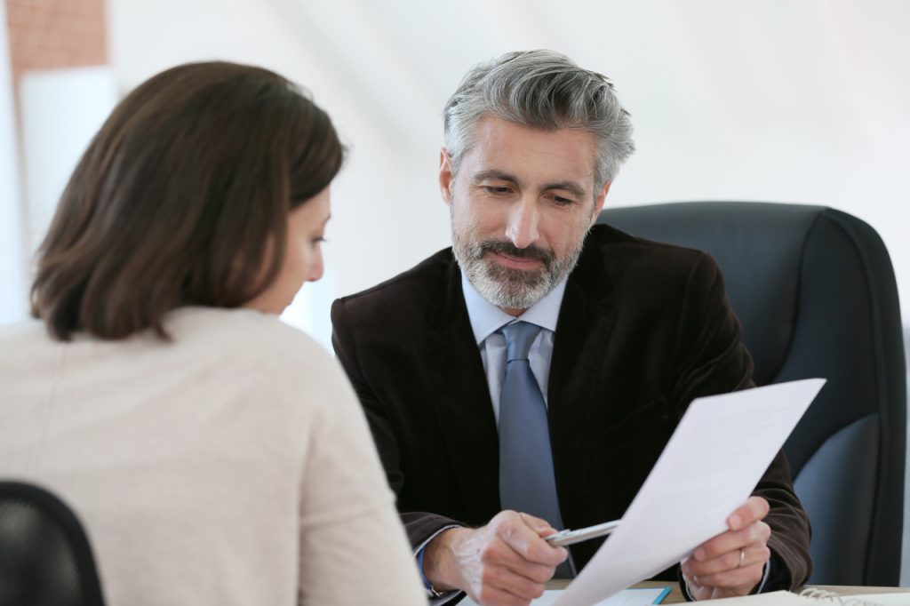 Attorney meeting client in office