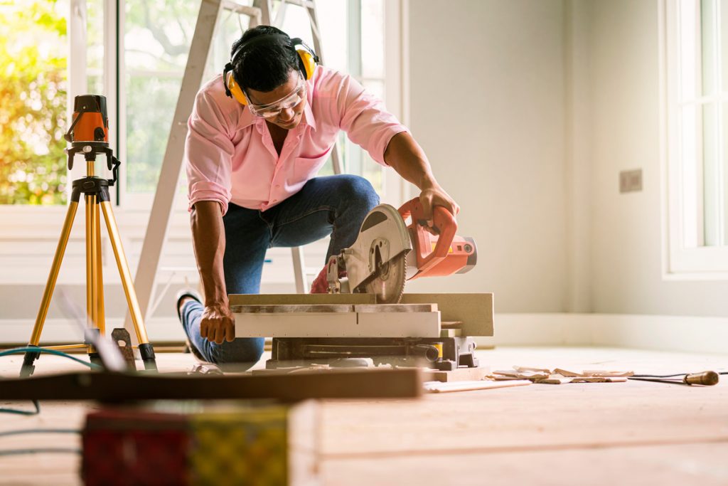 smart indian contractor hand use sawing machine wood work house