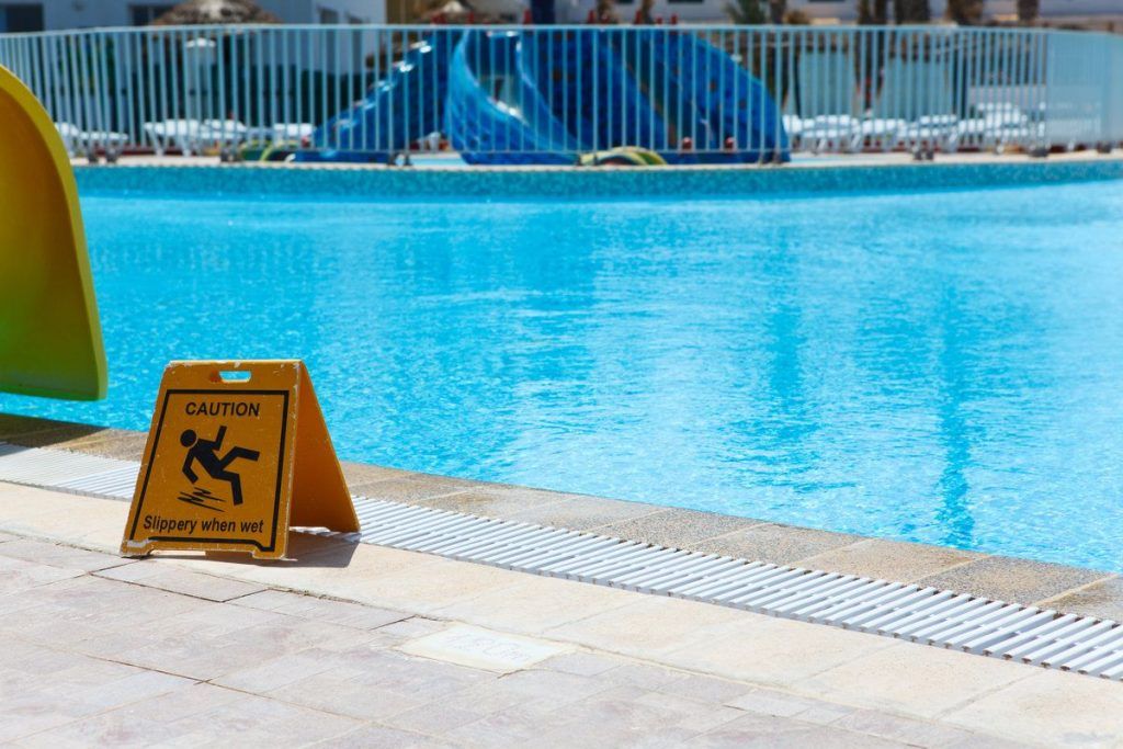 Wet floor plate is near swimming pool