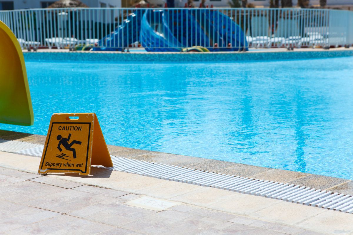 Wet floor plate is near swimming pool
